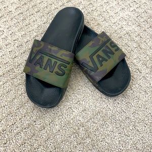 Men’s Vans camouflage slides.